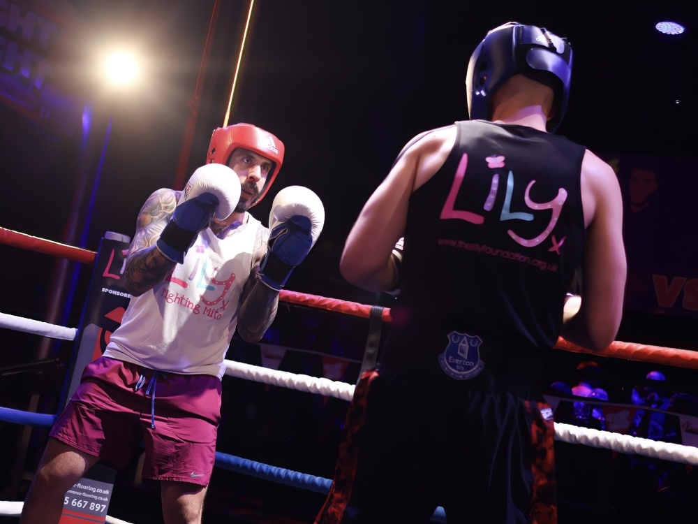 Two boxers sparring in the ring at the Clapham Grand