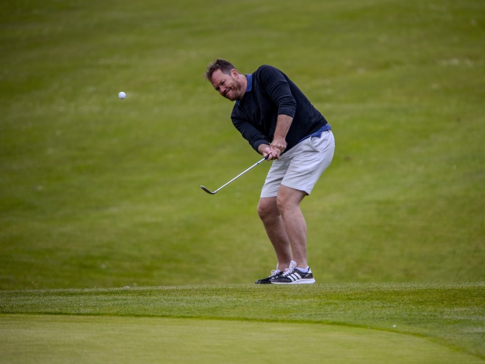 Lily South West Golf Day 2025 - A man on a golf course taking a swing with a club