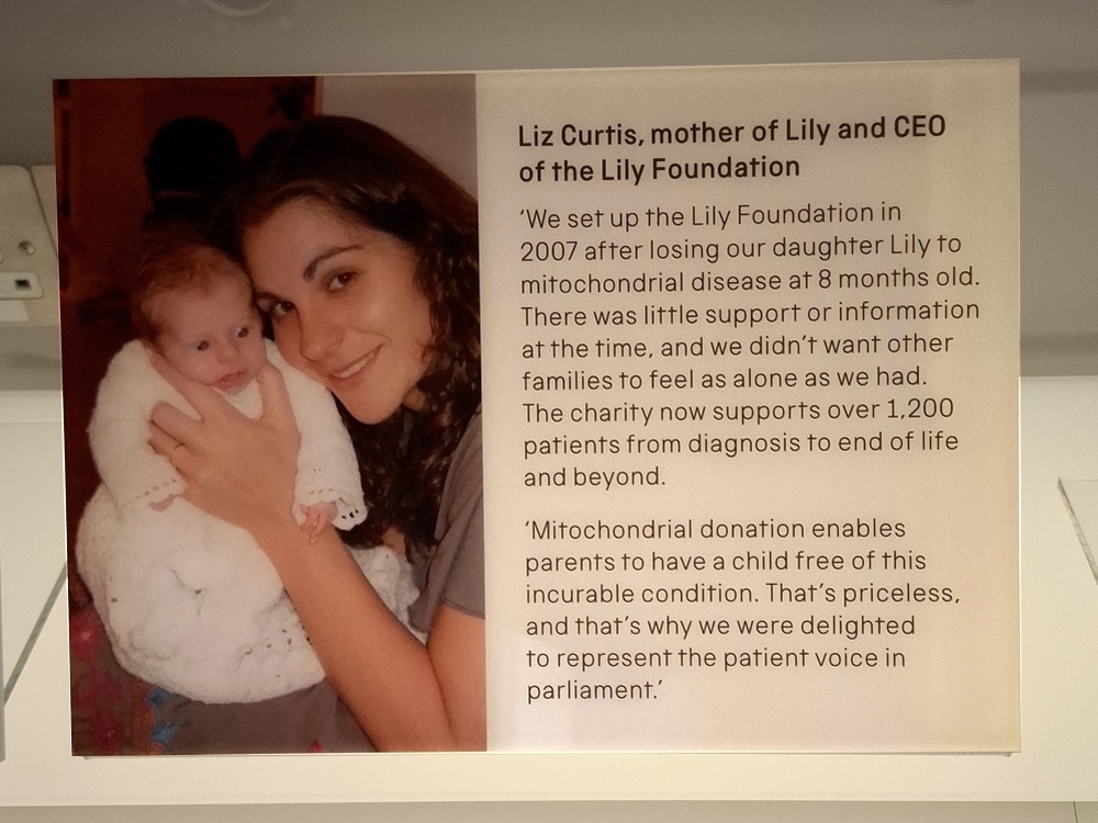 Close-up of a photograph of Liz and daughter Lily in the museum's display with a quote from Liz