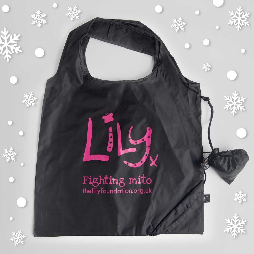 A black shopping bag featuring the Lily Foundation logo and websitre address in pink as well at the words fighting mito.