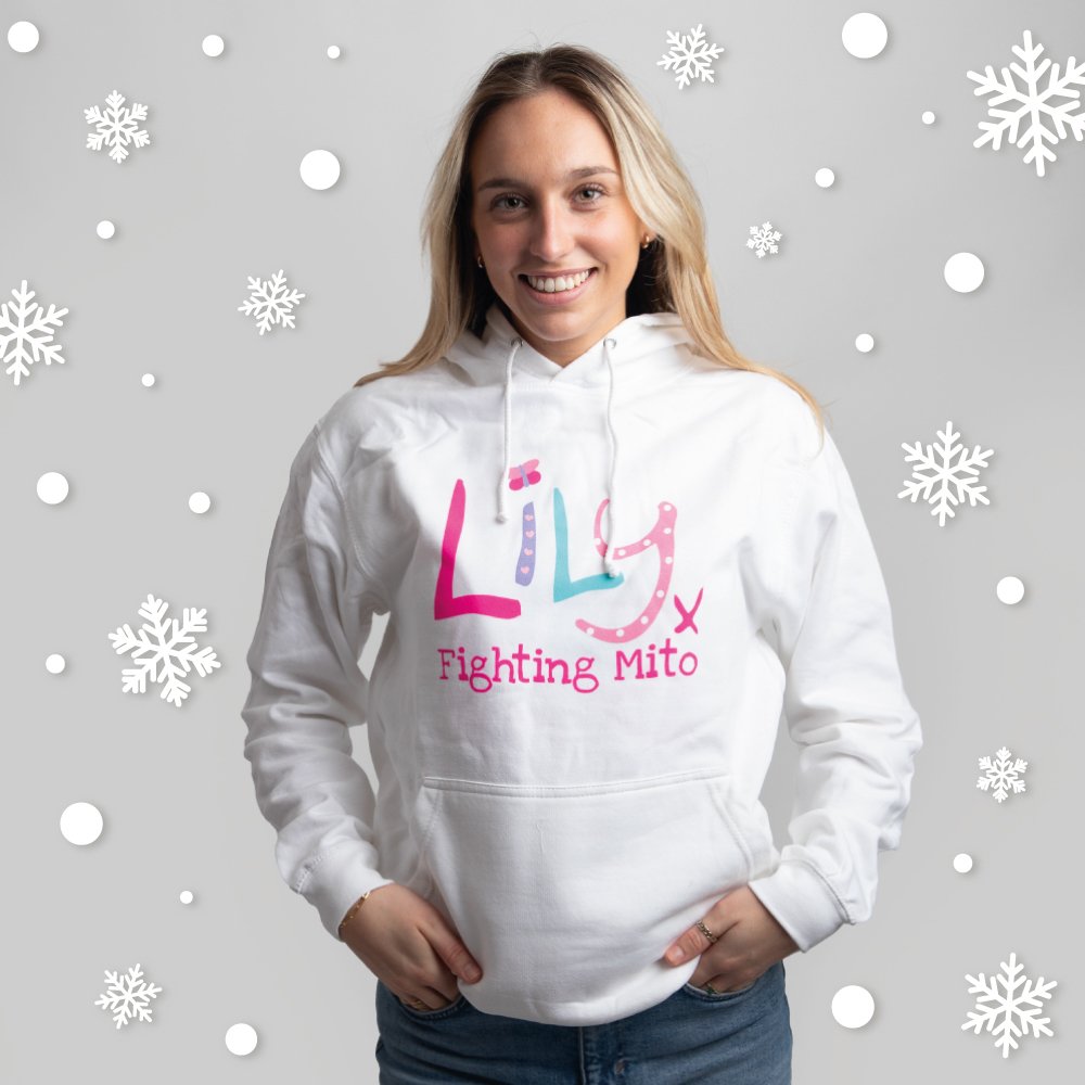 A smiling woman in a white hoodie featuring the Lily Foundation logo and the text fighting mito underneath.