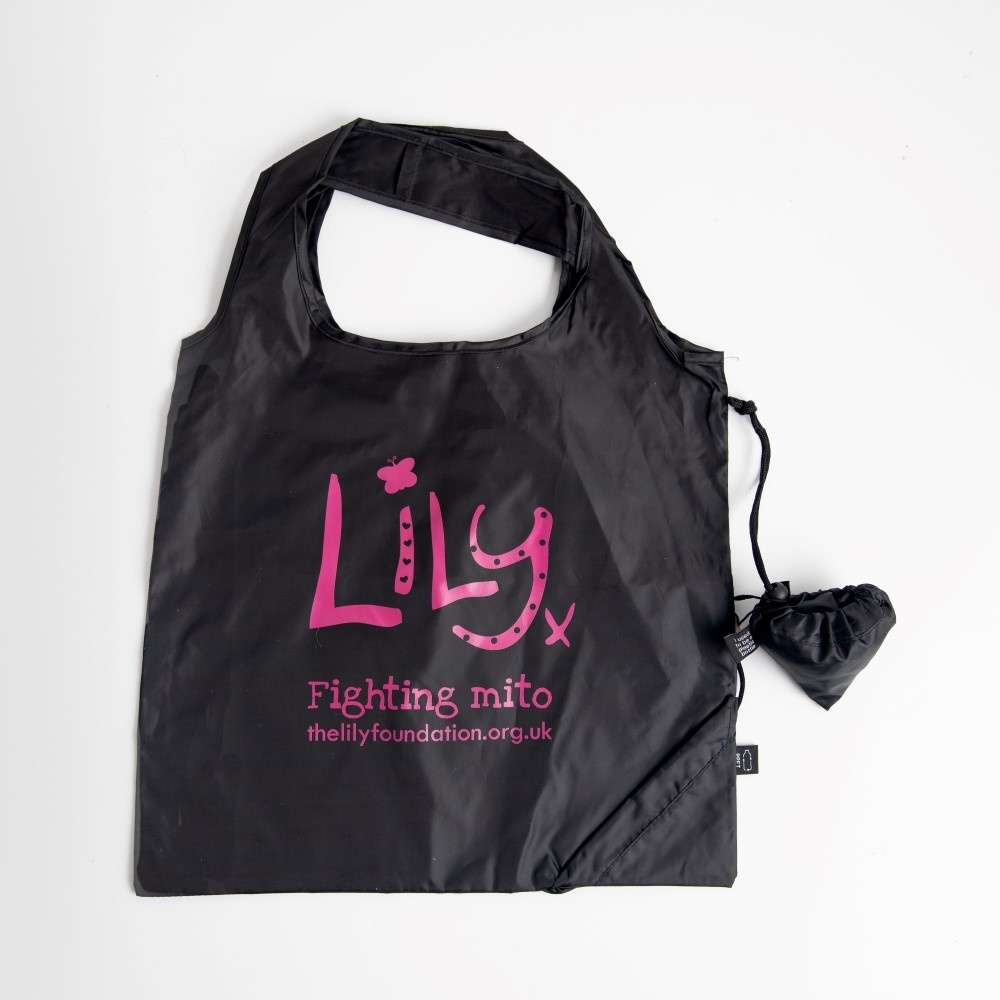 A black shopping bag featuring the Lily Foundation logo and websitre address in pink as well at the words fighting mito.