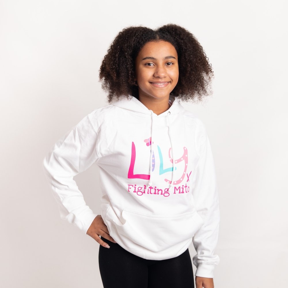 A young girl wearing a white hoodie featuring the Lily Foundation logo and website address.