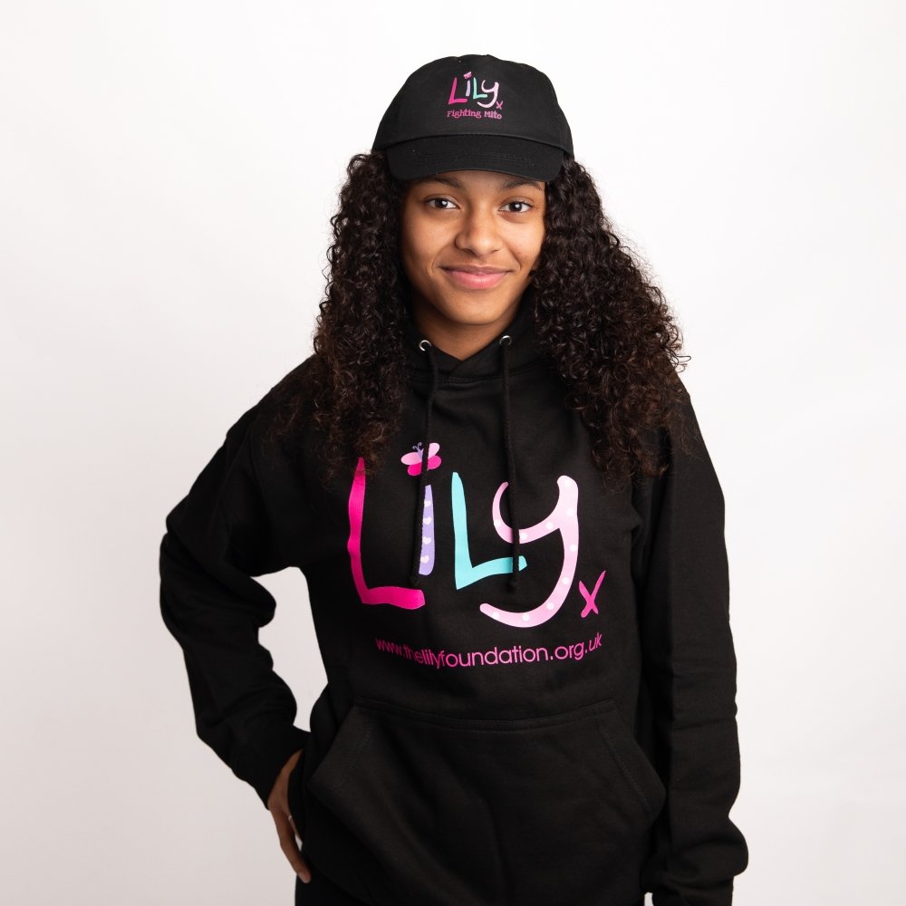 A young girl in a black hoodie featuring the Lily Foundation logo and website address.