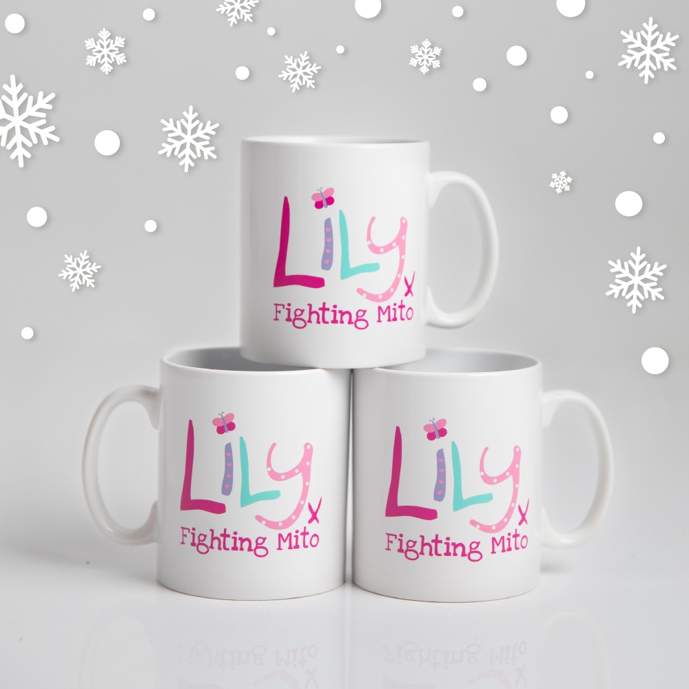 A stack of three white mugs featuring the Lily Foundation logo and the words fighting mito.