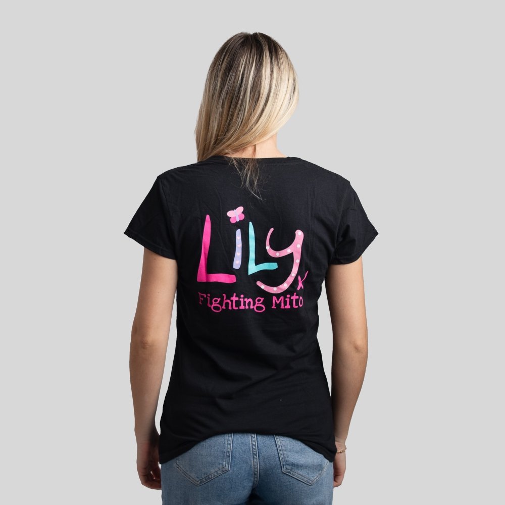 The back of a woman in a black t-shirt featuring the Lily logo and Fighting Mito underneath