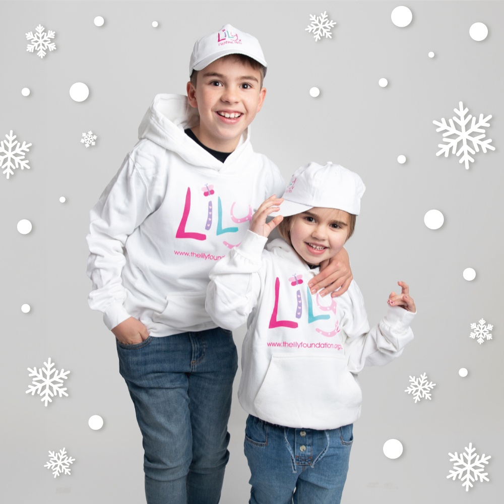 A young boy and girl both wearing white hoodies featuring the Lily Foundation logo and website address.