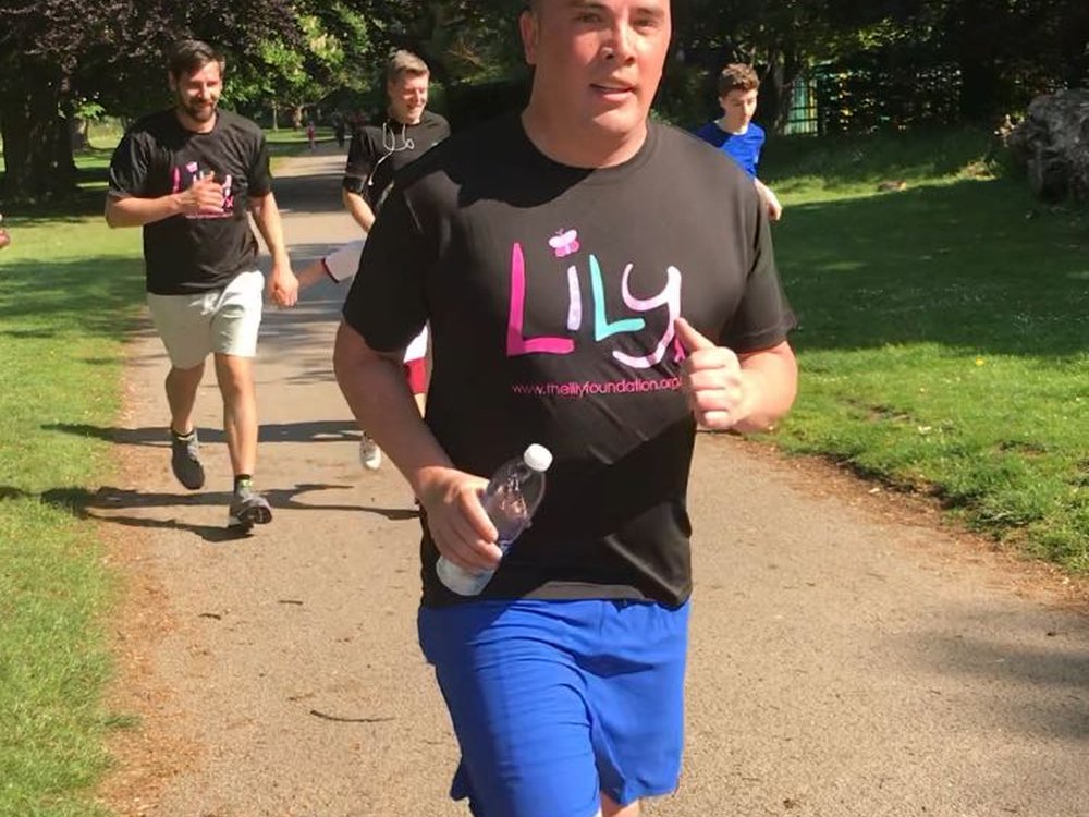 Man running in a Lily Foundation t-shirt