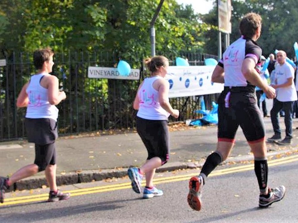 Gateshead Marathon - three people running on the street wearing Lily Tshirts