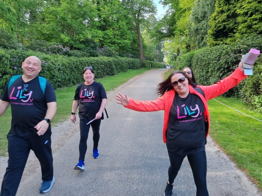 100 Miles in March 2025 - Four people in Lily Foundation tops walking along a lane lined with trees