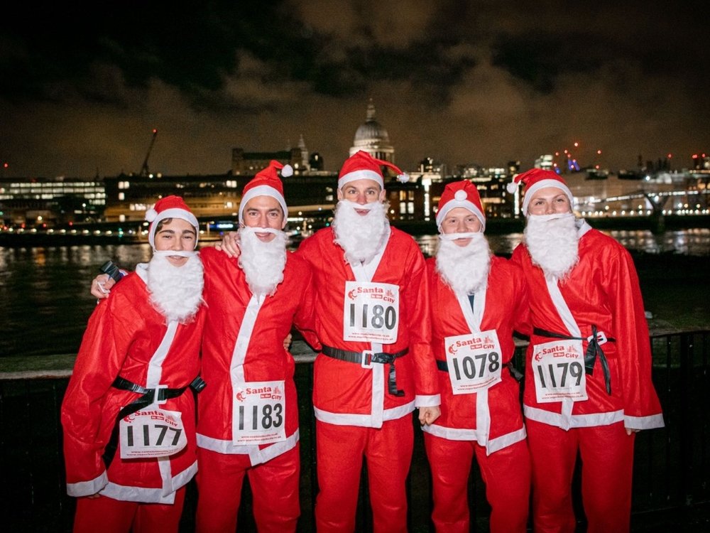 Santa in the City London 5th Dec 2024 - Runners in Santa suits taking part in a London Santa run for charity