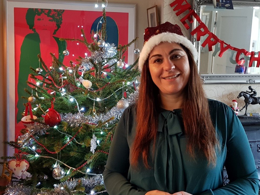 Lily Christmas Quiz 2024 - Lily Foundation CEO Liz in front of her Christmas tree for the festive quiz