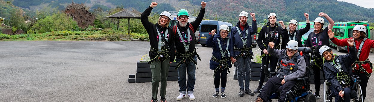 Group of mito patients and Lily Foundation volunteers wearing orienteering equipment in the Lake District