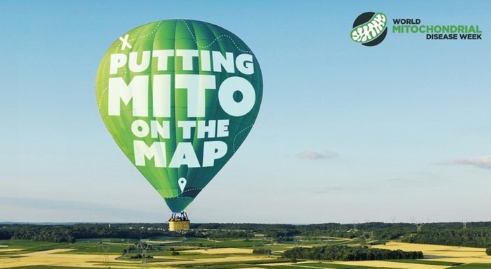 Hot air balloon floating in the sky with 'Putting mito on the map' logo on