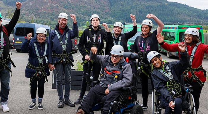 Group of mito patients and Lily Foundation volunteers wearing orienteering equipment in the Lake District