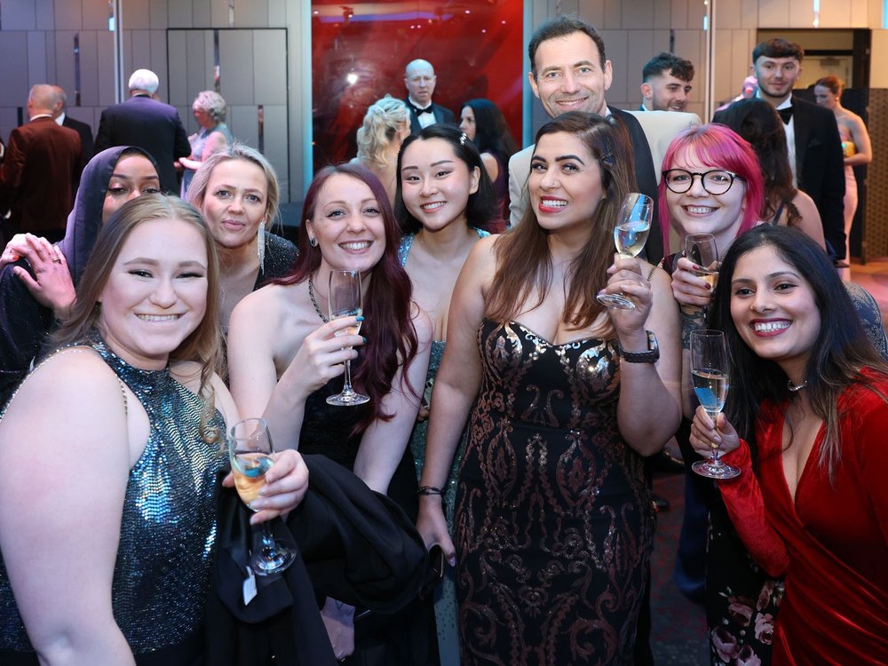 A group of ladies wearing party dresses at the Lily Foundation charity ball