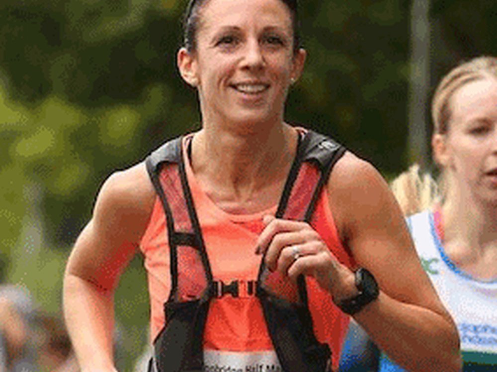 A head shot of a woman running towards the camera