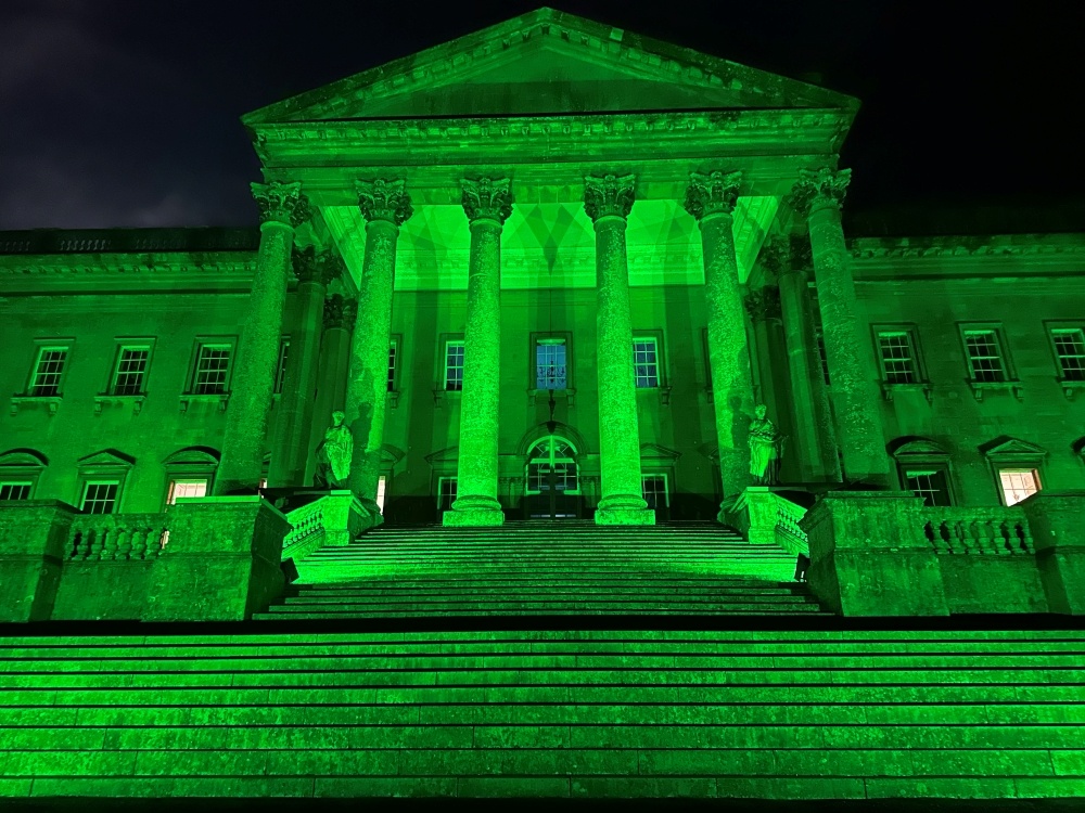 Prior Park Mansion in Bath lit up green in the darkness