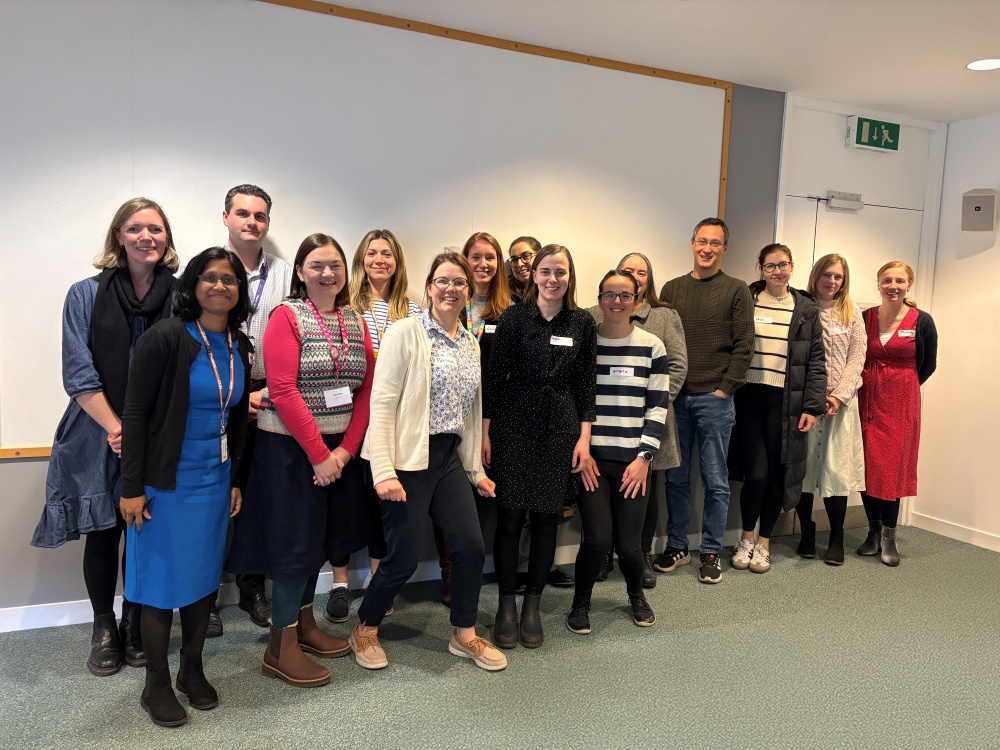 A group of registrars standing together for a training day on mitochondrial genetics