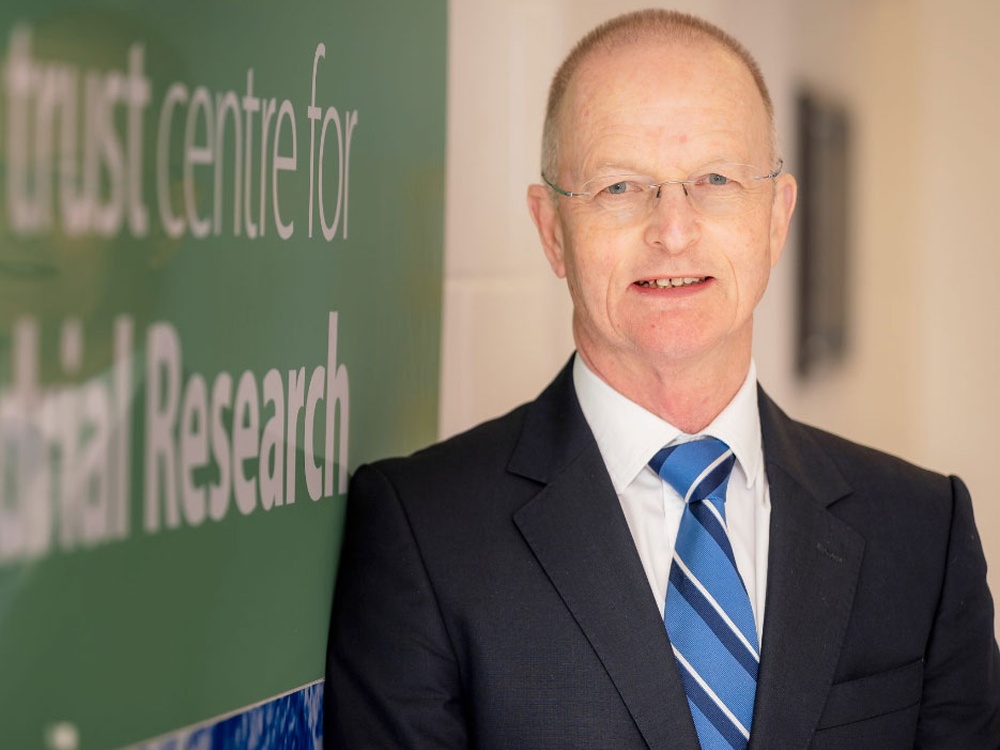 A head shot of Professor Doug Turnbull in a suit wearing glasses and a blue tie