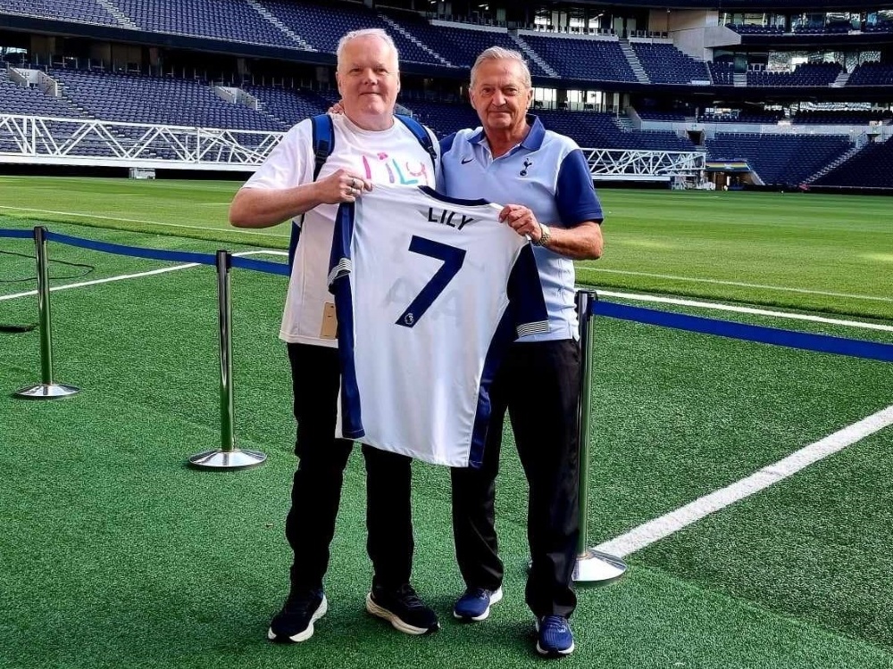 Kevin Day and Gary Mabbutt holding a replica Spurs shirt with the name Lily on the back