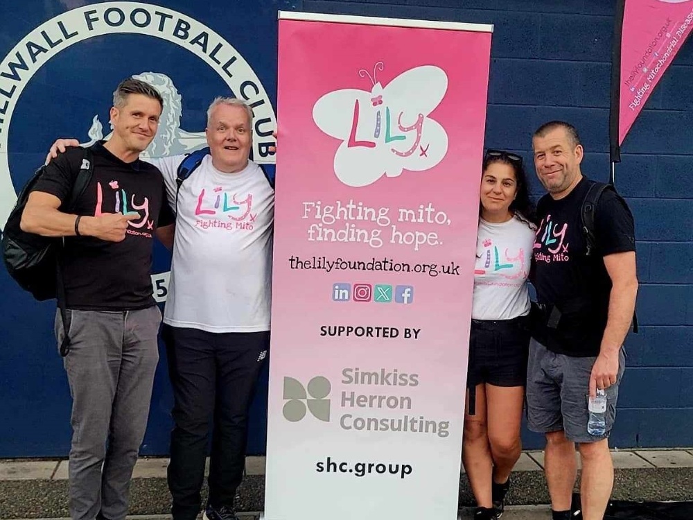 Kevin and supporters with a Lily banner outside Millwall stadium