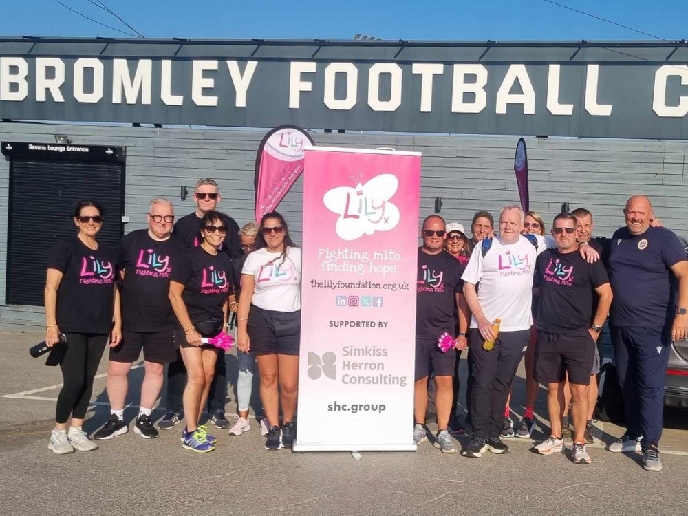 A team from Bromley meet Kevin outside their football ground