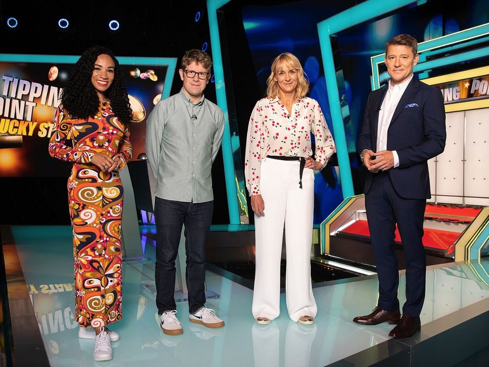 Celebrity comedian Josh Widdicombe in the stage of "Tipping Point" having won money for The Lily Foundation