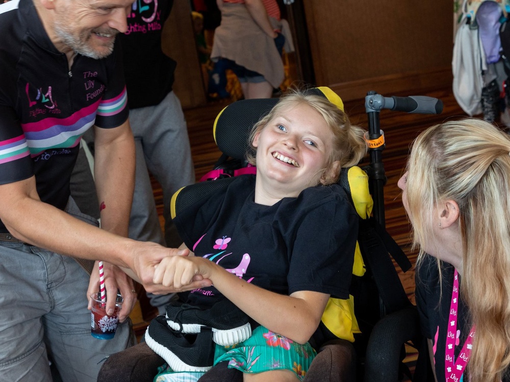 A young mito warrior in a wheelchair at the Lily family weekend