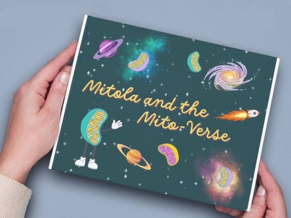 Hands holding the mitochondrial disease comic book