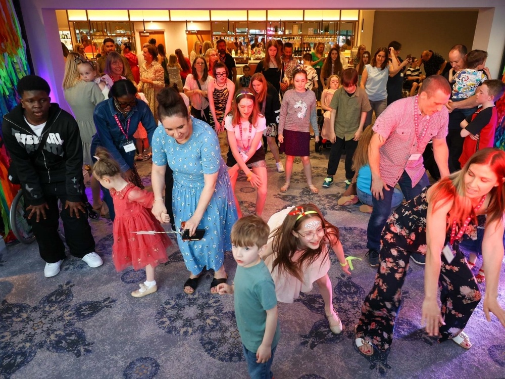 A group of people dancing at the disco at the Lily weekend