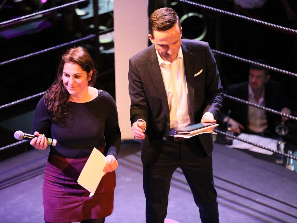 Lily founder Liz and presenter Adam Levanthal on stage at Lily fight night