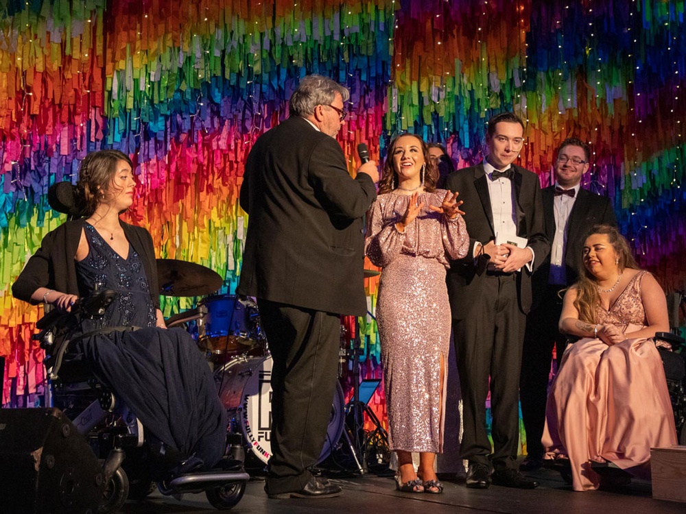 Young adult mito patients on stage at the Lily charity ball