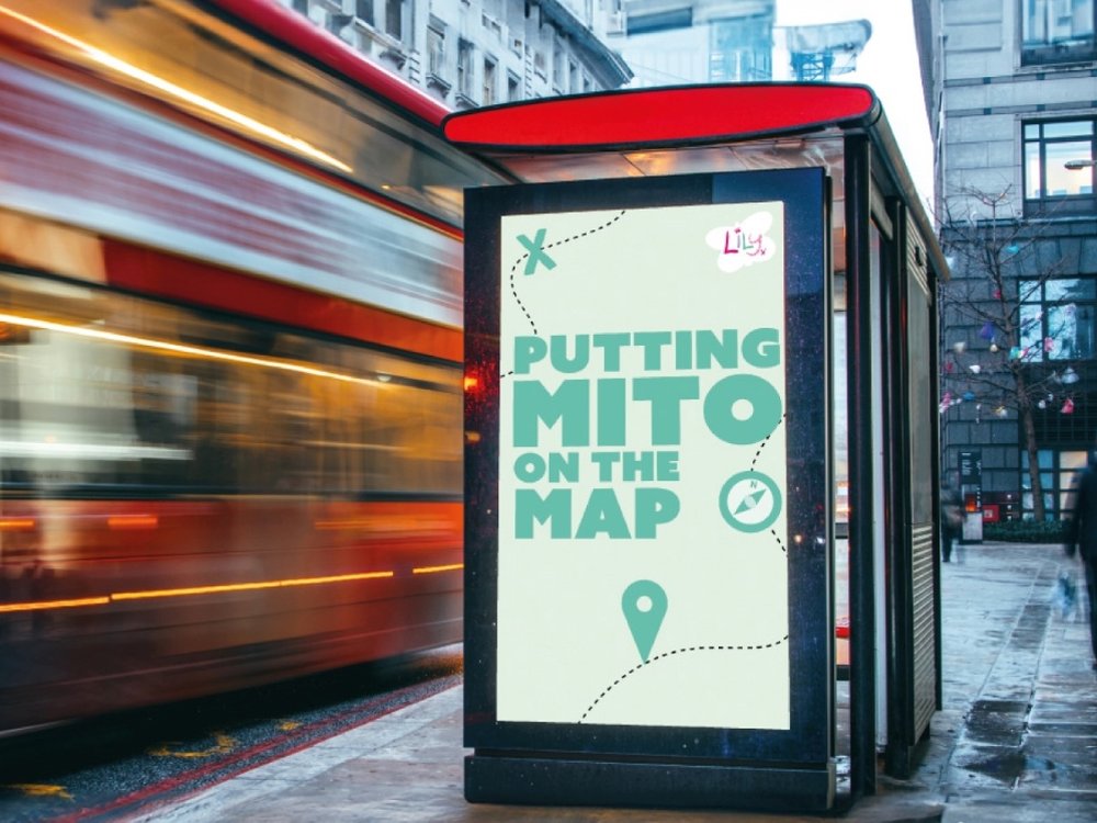 Putting mito on the map - A poster at a bus shelter with the words 'Putting mito on the map' on the side